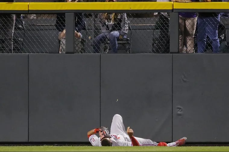 Phillies outfielder Aaron Altherr left Monday night's 10-1 loss to the Colorado Rockies after crashing face-first into the left-field wall at Coors Field.