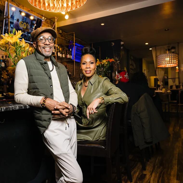 Tracey and Cheri Syphax at Booker's on Baltimore Avenue. The Syphaxes bought Booker's and the Bayou Lounge in early March from former owner Saba Tedla.