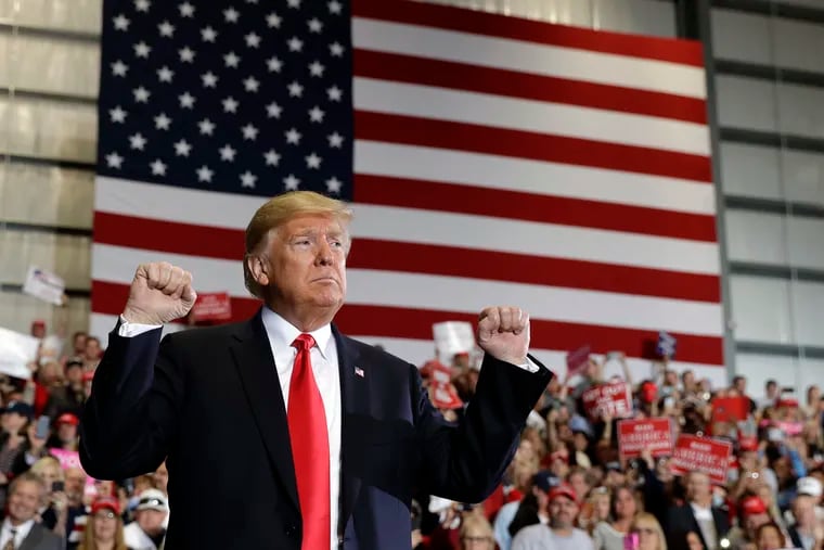 President Trump looks to the crowd after speaking at a campaign rally at Pensacola International Airport, Saturday, Nov. 3, 2018, in Pensacola, Fla.