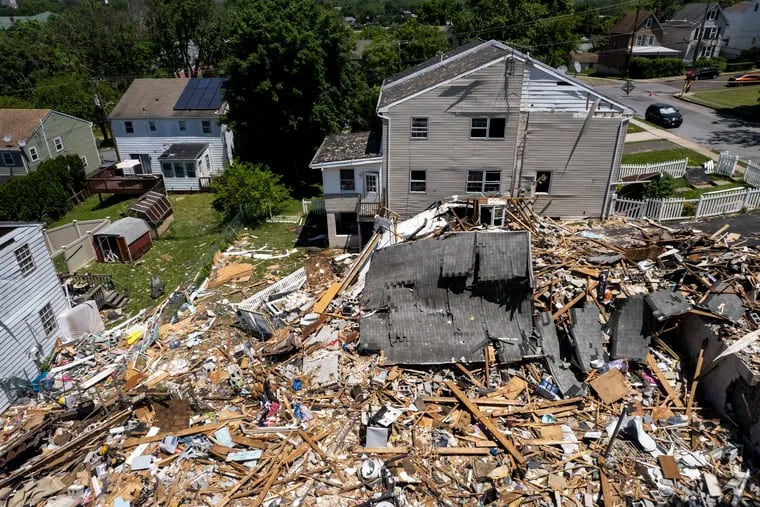 File photo of debris covering the site of the explosion at the corners of Butler Avenue and Hale Street in Pottstown, Pa. Five people were killed in the explosion, including four children.
