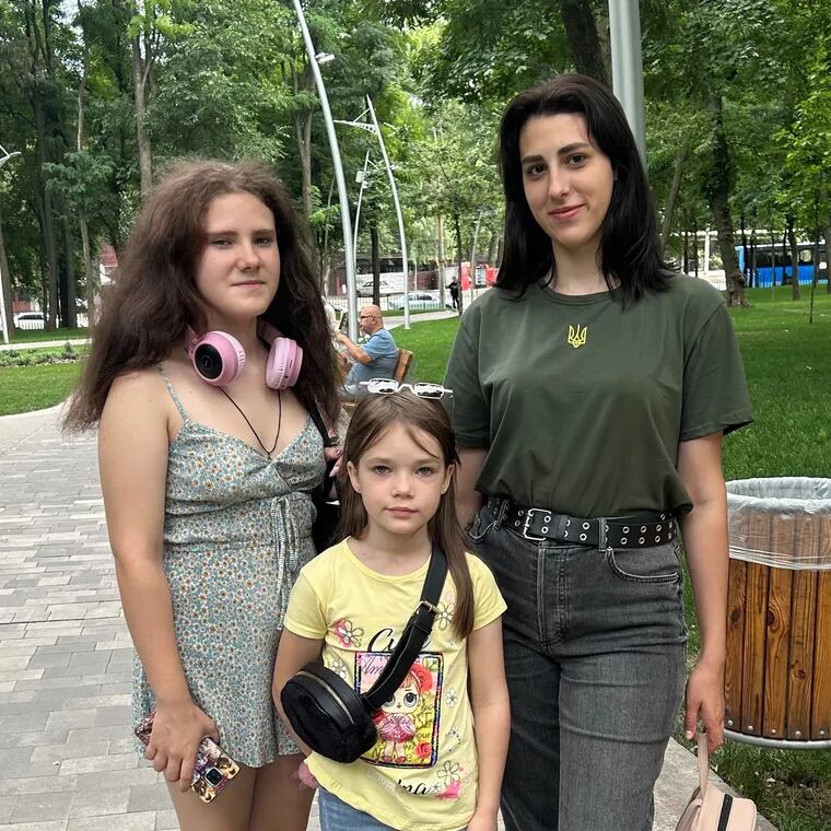 Valentina Yermachkova, 20, (right) rescued her sisters, Sofiia, 15, (left) and Anastasia, 9, from Russian-occupied territory in Ukraine. Their mother and brother were killed by Russian shelling in Mariupol.