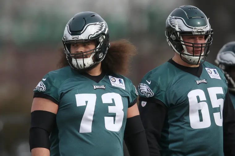 Eagles offensive lineman Isaac Seumalo (73) walks next to tackle Lane Johnson (65) at the start of practice at the NovaCare Complex in South Philadelphia on Friday, Jan. 4, 2019. The Eagles play the Chicago Bears in a first-round playoff game Sunday.