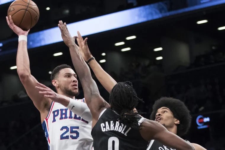 Sixers guard Ben Simmons (left) goes to the basket past Brooklyn Nets forward DeMarre Carroll (9) and center Jarrett Allen (31) during the first half of an NBA basketball game, Wednesday, Jan. 31, 2018, in New York.