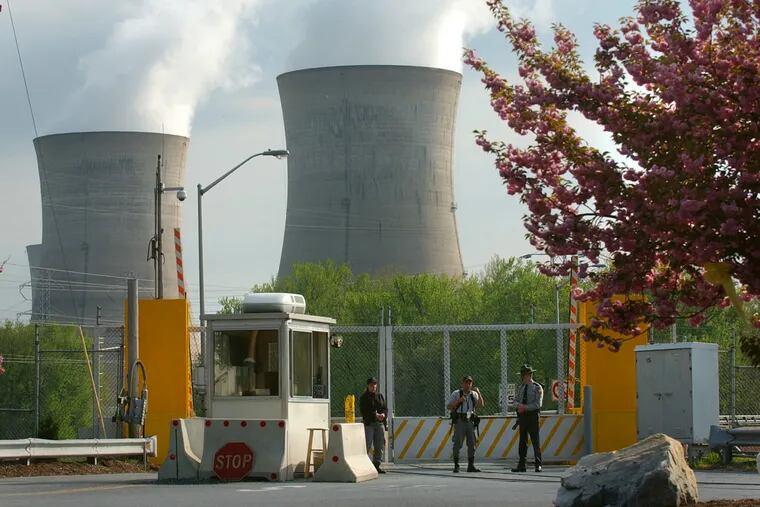 Armed personnel stand in front of the security gate leading to Three Mile Island nuclear power plant Wednesday, April 30, 2003, in Harrisburg, Pa. In 2003, the Rendell administration has halted daily patrols by the National Guard and state police at Pennsylvania's five nuclear reactors.