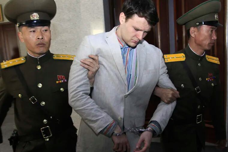 FILE - In this March 16, 2016, file photo, American student Otto Warmbier, center, is escorted at the Supreme Court in Pyongyang, North Korea. North Korea reportedly insisted the U.S. pay $2 million in medical costs in 2017 before it released Warmbier while he was in a coma.