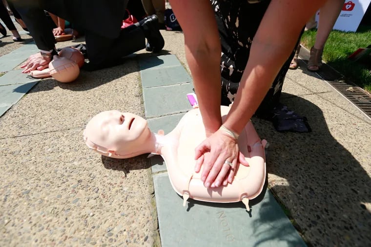 Laura Pappas of King of Prussia, from Dyanavic, learns CPR. Philadelphia's Mobile CPR Project is a public health initiative that aims to educate as many Philadelphia residents as possible in hands-only CPR.