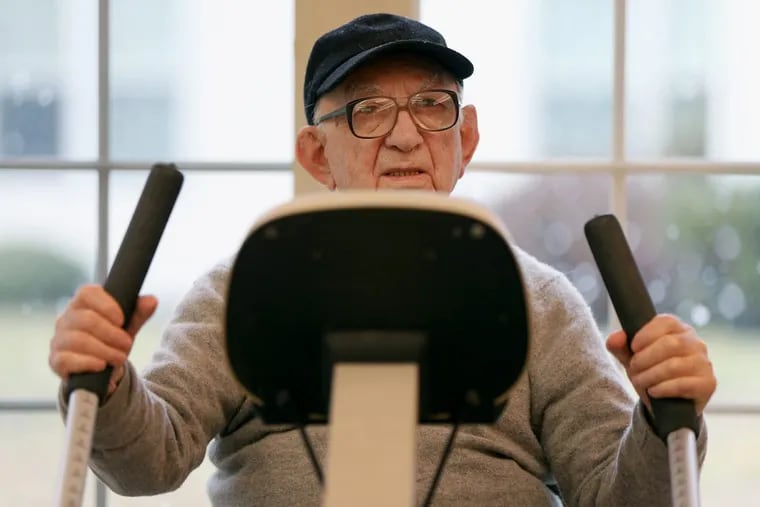 Yehuda Hammer, 101, demonstrates part of his exercise routine — 30 minutes on a recumbent cross trainer — at the Lions Gate retirement community in Voorhees Township, N.J., on Tuesday, Jan. 30, 2018. TIM TAI / Staff Photographer