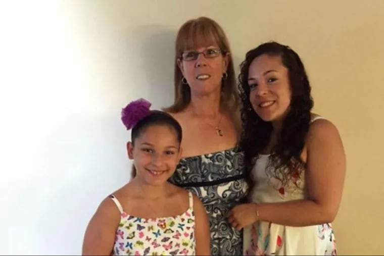 Anna Mesoraca (center) obtained permanent custody of granddaughters Alyssa, left, and Gianna when her son died in 2008.