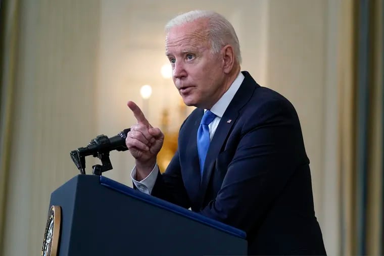 President Joe Biden takes questions from reporters as he speaks about the American Rescue Plan, in the State Dining Room of the White House on Wednesday.