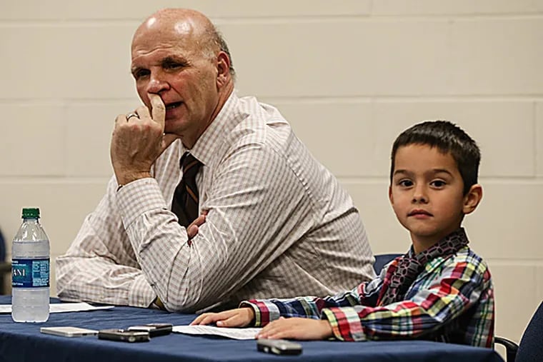 Saint Joseph's head coach Phil Martelli with his grandson. (Steven M. Falk/Staff Photographer)