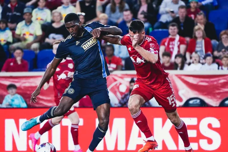 The Union's Damion Lowe (left) on the ball in front of New York's Sean Nealis (right) during Saturday's game.