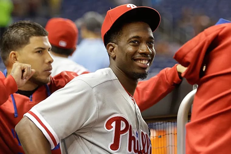 Philadelphia Phillies' Darnell Sweeney, center, stands in the dugout before a baseball game against the Miami Marlins, Thursday, Aug. 20,
2015, in Miami. Sweeney was acquired from the Los Angeles Dodgers in the Chase Utley trade.