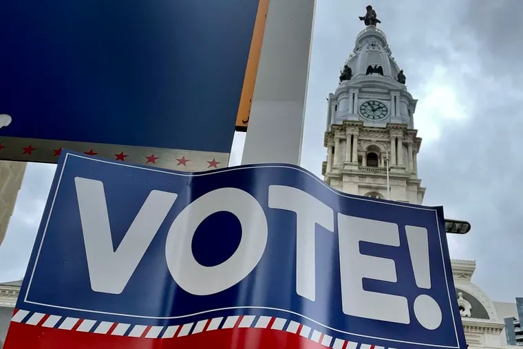 An Election Day sign on a pole near Philadelphia City Hall in November 2022.