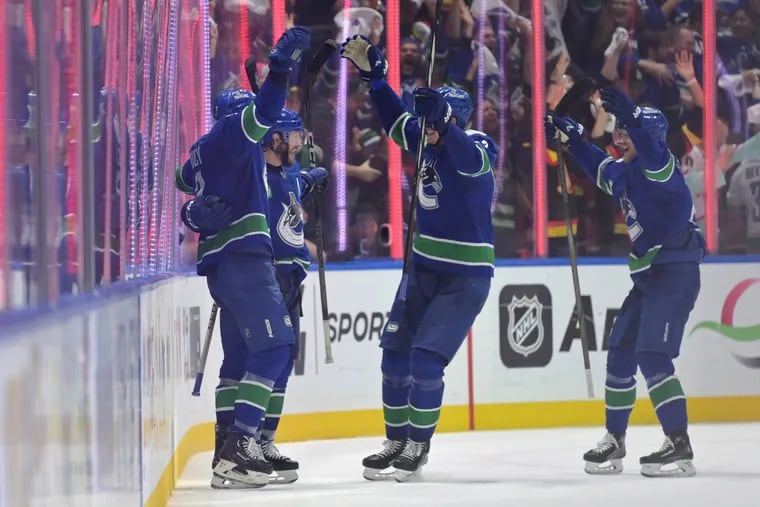 J.T. Miller #9 of the Vancouver Canucks celebrates the game-winning goal against the Edmonton Oilers during the third period in Game Five of the Second Round of the 2024 Stanley Cup Playoffs at Rogers Arena on May 16, 2024, in Vancouver, British Columbia.  (Photo by Derek Cain/Getty Images)