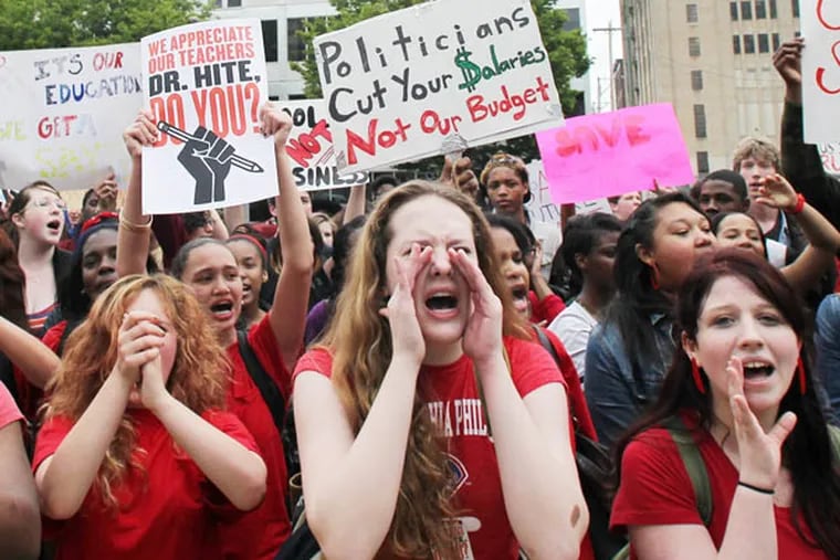 High school students chant at the Philadelphia School District headquarters on North Broad Street to protest budget cuts on Tuesday, May 7, 2013.