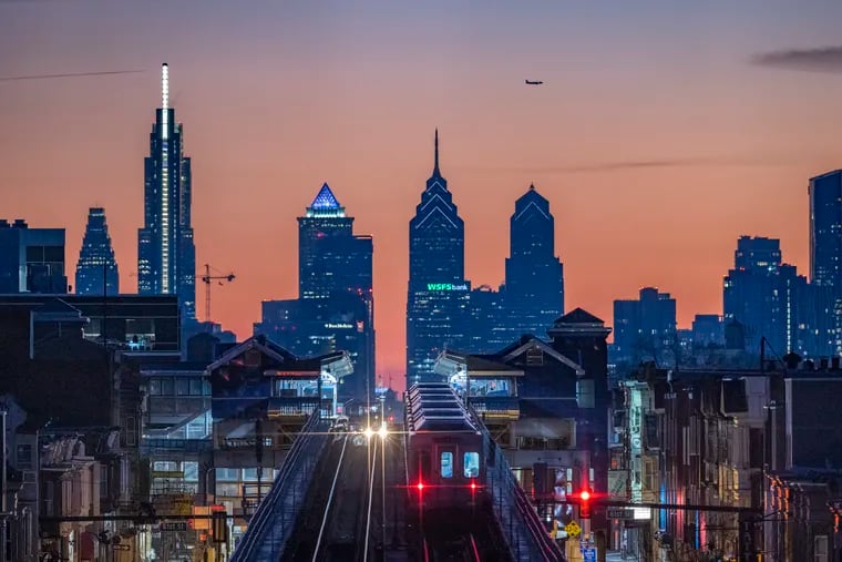 Skyline of Philadelphia during sunrise on Dec. 21, 2022. Photograph taken from bridge over 63rd Street SEPTA Station for Market Frankford train. The daily commute will soon look a lot different with new art created through the Public Works artist residency