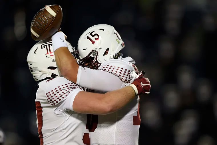 Temple's Anthony Russo, right, celebrates a touchdown run against Navy with Michael Niese.
