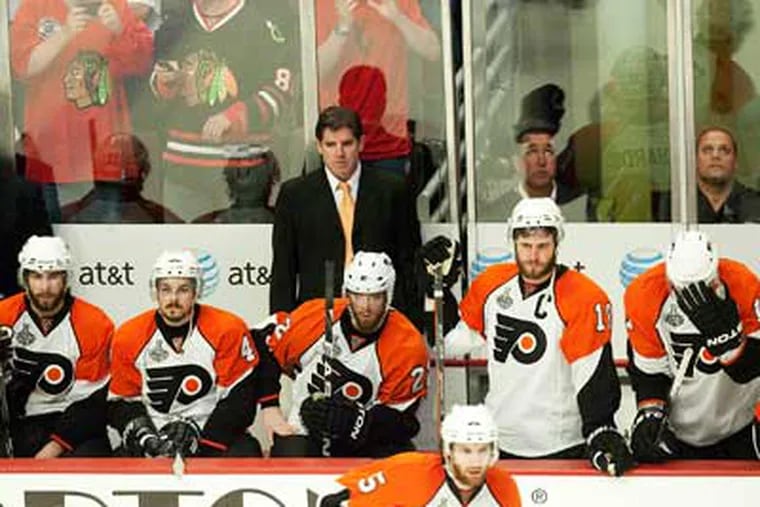 A dejected Flyers team reacts from the bench, with seconds left in Game 5 of the Stanley Cup Finals. (Ed Hille / Staff Photographer)