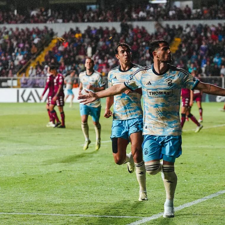 Julián Carranza (right) celebrates one of his three goals in the Union's Concacaf Champions Cup win at Costa Rica's Saprissa.