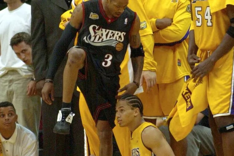 Allen Iverson of the Sixers famously steps over the Lakers' Tyronn Lue in Game 1 of 2001 Finals.