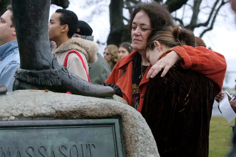 In this Nov. 25, 2004 file photo, Native American supporter Deborah Theodore, left, of Belmont, Mass., and her daughter, Sofia Theodore-Pierce stand together by the statue of Massasoit on Cole's Hill in Plymouth, Mass., during the 35th National Day of Mourning. United American Indians of New England held the first National Day of Mourning in 1970, and again plan to gather at noon on Thanksgiving Day, Thursday, Nov. 28, 2019.