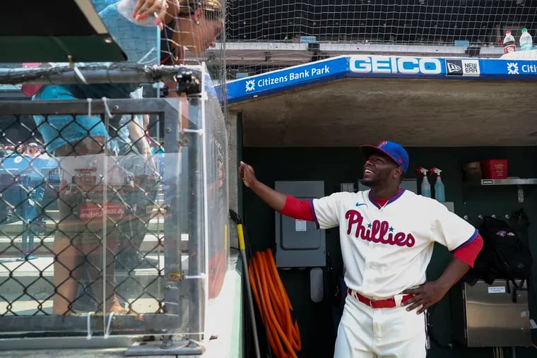 Philadelphia Phillies relief pitcher Hector Neris (50) talks with a fan before the Philadelphia Phillies game against the Atlanta Braves at Citizens Bank Park in Philadelphia, Pa., on Sunday, July 25, 2021.