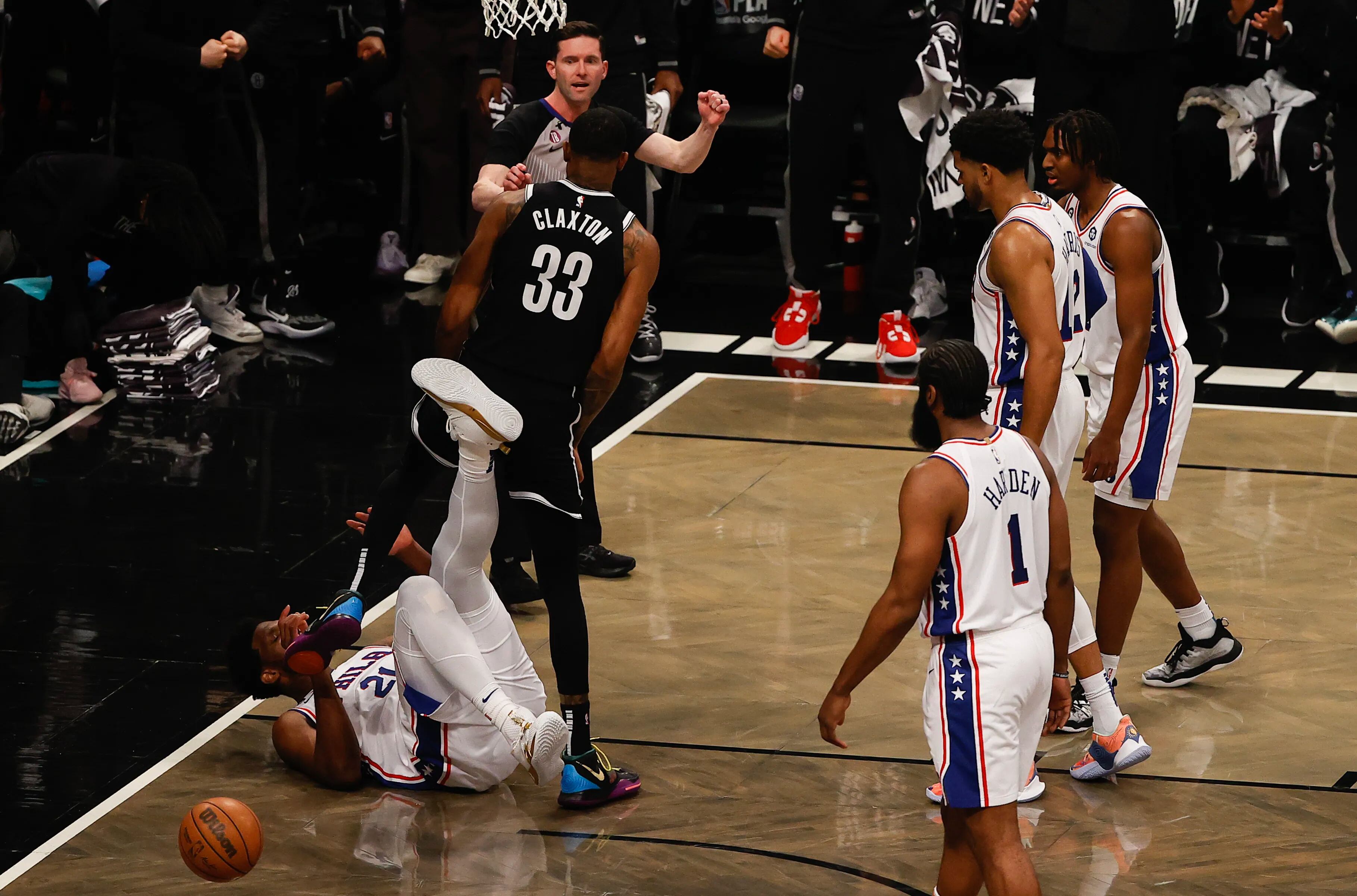 Sixers center Joel Embiid kicks Brooklyn Nets center Nic Claxton during the first quarter in Game 3 in the first round of the Eastern Conference playoffs on Thursday, April 20, 2023 in New York.