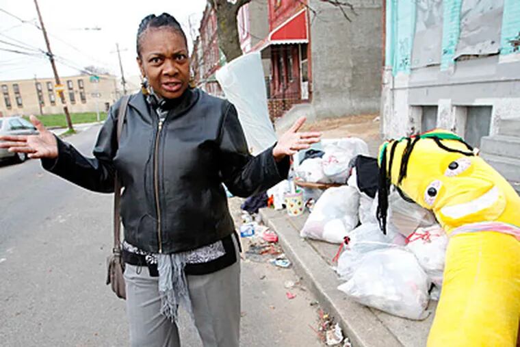 Eleanor Blunt is frustrated with Temple University students who put their trash out early and do not recycle or maintain the appearance in front of their rental property.  (ALEJANDRO A. ALVAREZ / STAFF PHOTOGRAPHER )