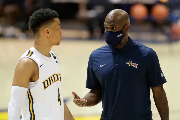 Drexel  guard Xavier Bell with assistant coach Mike Jordan.  (FILE PHOTO)