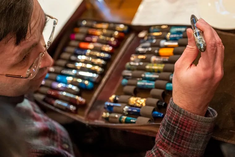 Stan Minkovsky shows off his collection of fountain pens at the second meeting of the Philly Pen Circle.