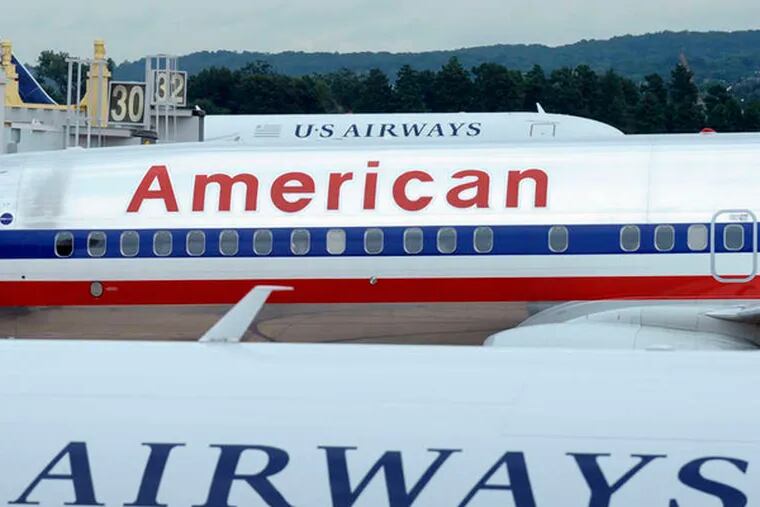 It's official! American Airlines emerged from bankruptcy protection and US Airways culminated its long pursuit of a merger partner as the two completed their deal Monday, Dec. 9, to create the world's biggest airline. The combined airline will carry 77 percent of passengers at Philadelphia International Airport. (Associated Press)