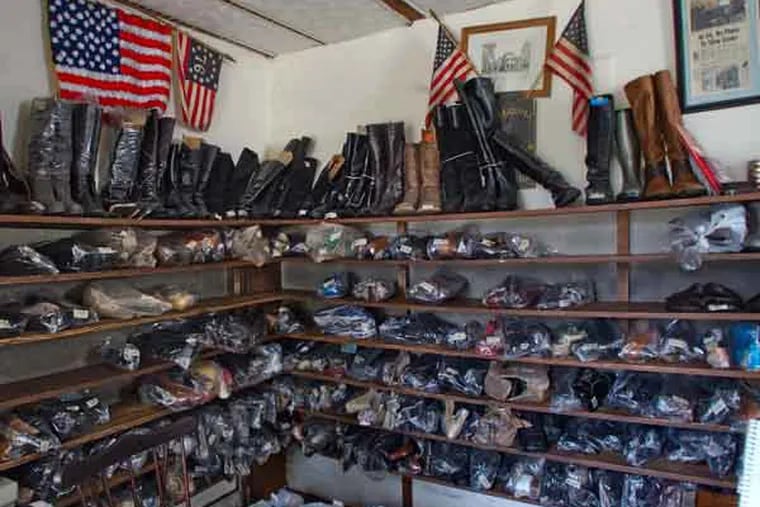 Shoes that were repaired, but not claimed, rest on shelves. Owner James Spinelli said they will be donated from the store, Quaker Shoe Repair, in Haddonfield. September 18, 2014. ( DAVID M WARREN / Staff Photographer )