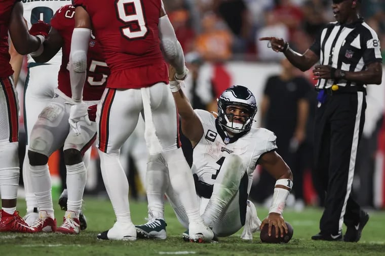 Philadelphia Eagles quarterback Jalen Hurts (1) is helped up after a sack in the fourth quarter of the game against the Tampa Bay Buccaneers in Tampa, Fla., on Monday, Sept. 25, 2023.
