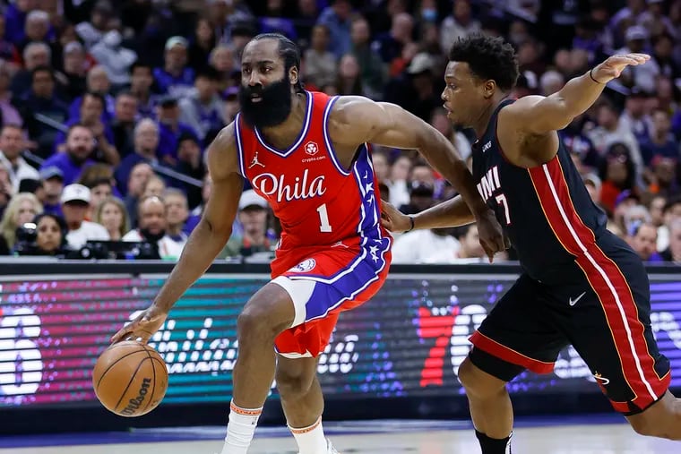 Sixers guard James Harden dribbles the basketball against Miami Heat guard Kyle Lowry during game four of the second-round Eastern Conference playoffs on Sunday, May 8, 2022 in Philadelphia.