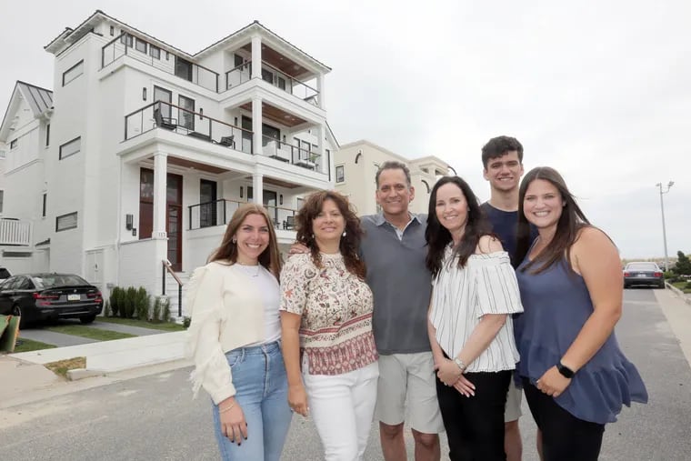 Construction of a new house brought together two families who love this Margate beachfront property. Pictured (from left) are designers Mariah Frantz, whose grandparents once owned a home there, and Christine Schwartz, both from Surroundings Interiors, and present owners Brad Beidner, his wife, Michelle, and children, Spencer and Gari.