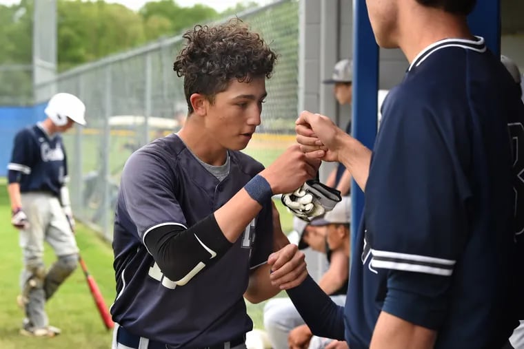 Timber Creek junior Jon Martinez is greeted at home by teammates after scoring run vs. Winslow Twp. Martinez has been left homeless by disasters twice in the last two years — by a hurricane in Florida in 2017 and by a fire in Gloucester Twp. on April 28.
