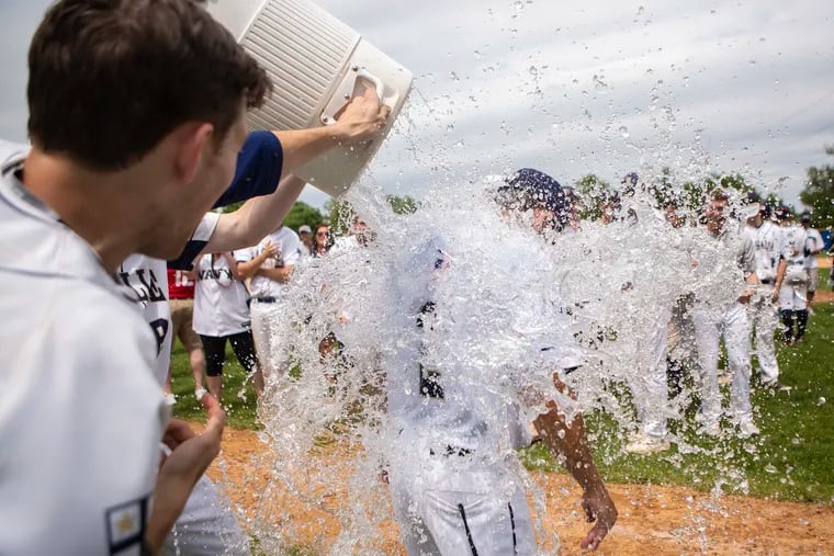 La Salle baseball players pour water over head coach Kyle Werman after defeating Cardinal O'Hara, 4-1, for the Catholic League championship at Widener University in Chester, PA on Saturday, May 25, 2019.