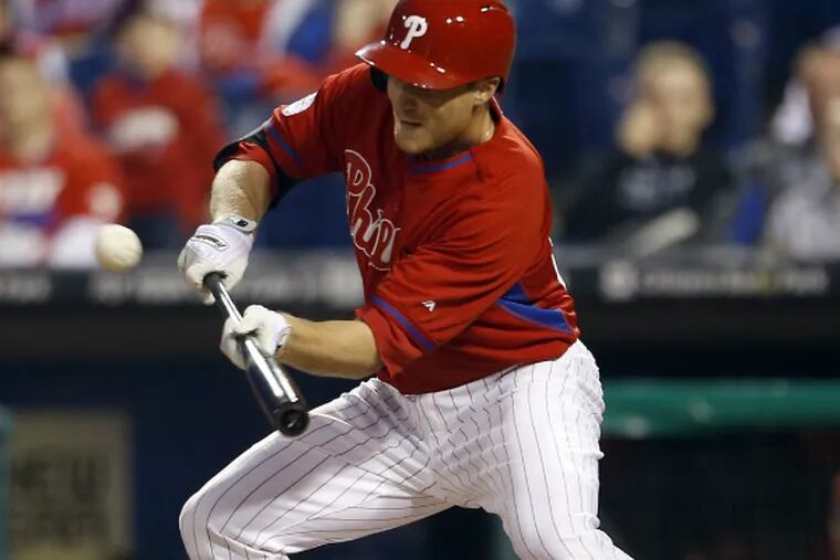 Cody Asche is working hard to improve and keep his job as the Phillies' everyday third baseman. (Yong Kim/Staff Photographer)