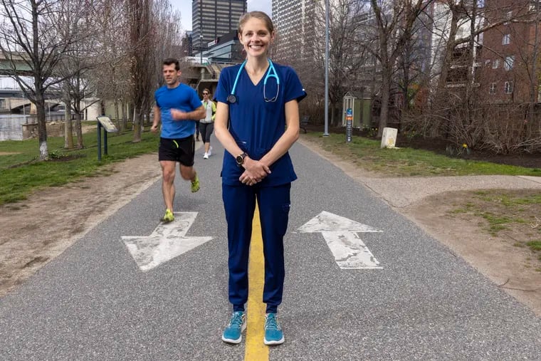 Penn nurse Sam Roecker is running the Boston Marathon in nursing scrubs, raising funds to support nurses' mental health and wellbeing. She sometimes trains on the Schuylkill River Trail, logging up to 100 miles a week.