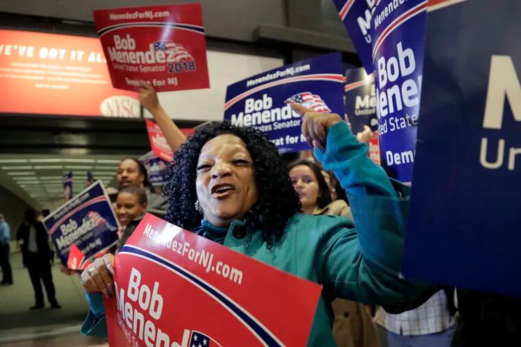 Supporters of Democratic U.S. Senate candidate Bob Menendez shout at supporters of Republican candidate Bob Hugin outside of the NJTV Studios where the two are scheduled to engage in a debate, Wednesday, Oct. 24, 2018, in Newark, N.J. (AP Photo/Julio Cortez)