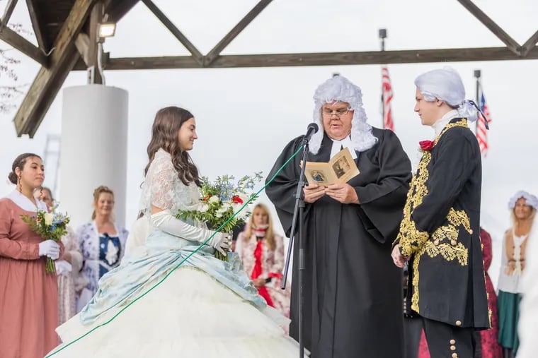 Seventeen-year-old Gloucester City High School students Natalee Azzari and Jakob Spotts re-enact the 1773 wedding of Betsy Griscom Ross and John Ross in Gloucester City, N.J. Mayor Dayl Baile, as Justice of the Peace James Bowman, officiates.