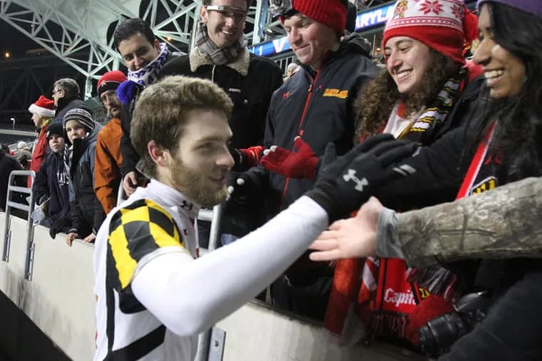 Maryland's Patrick Mullins is congratulated by the Maryland fans after
Maryland defeated Virginia. (Charles Fox/Staff Photographer)