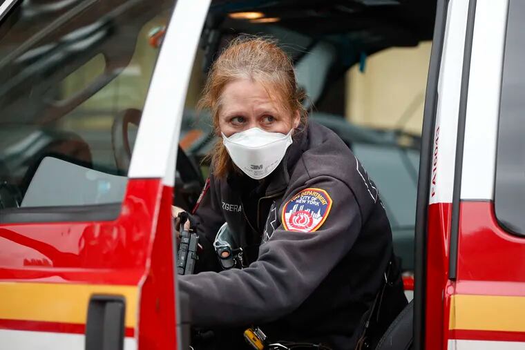 An FDNY medical worker wears personal protective equipment outside a COVID-19 testing site at Elmhurst Hospital Center in New York.