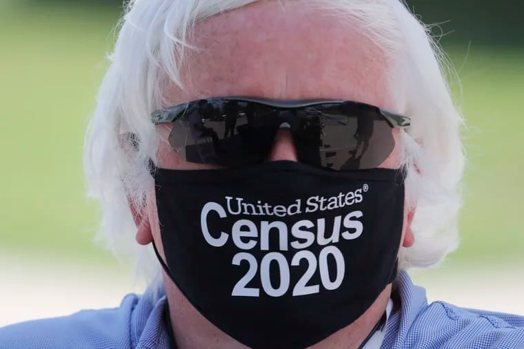 Amid concerns of the spread of COVID-19, census worker Ken Leonard wore a mask as he manned a U.S. Census walk-up counting site set up for Hunt County in Greenville, Texas last week.