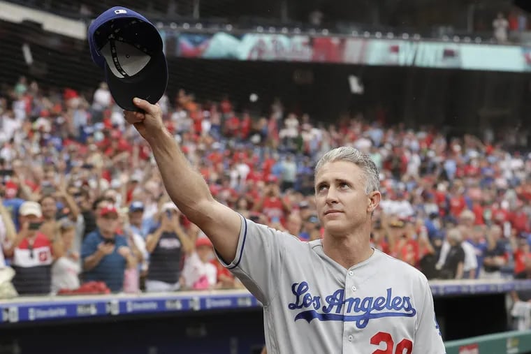 Chase Utley tips his cap to the fans at Citizens Bank Park during one of his final appearances in Philly as an active player.