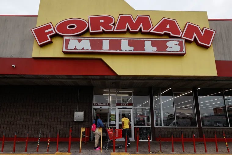 Forman Mills workers outside the store on Aramingo Avenue in Port Richmond on Thursday, June 22, 2023.  Forman Mills, the New Jersey-based retail discount store, has avoided a bankruptcy by finding a buyer for the company.