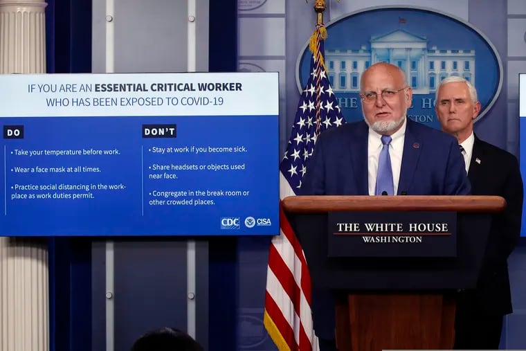 Dr. Robert Redfield, director of the Centers for Disease Control and Prevention, speaks as charts are displayed during a briefing about the coronavirus in the James Brady Press Briefing Room of the White House, Wednesday, April 8, 2020, in Washington, as Vice President Mike Pence listens.