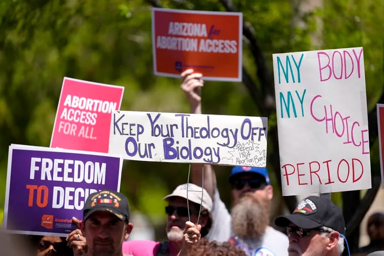 Abortion rights supporters gather outside the Capitol in Phoenix.