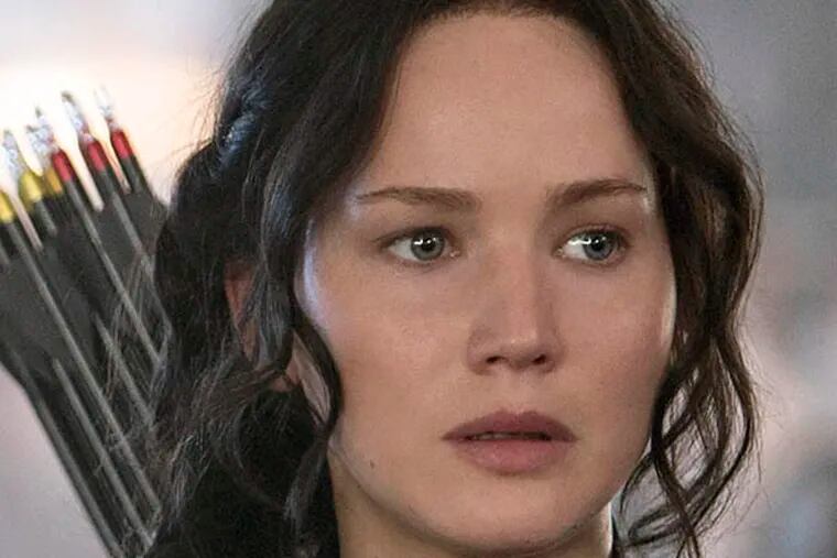 Jennifer Lawrence portrays Katniss Everdeen in a scene from "The Hunger Games: Mockingjay Part 1." (AP Photo/Lionsgate, Murray Close)