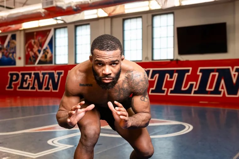 Jordan Burroughs stands guard inside the wrestling room at the University of Pennsylvania in preparation for Team USA's Olympic trials at State College later this month.